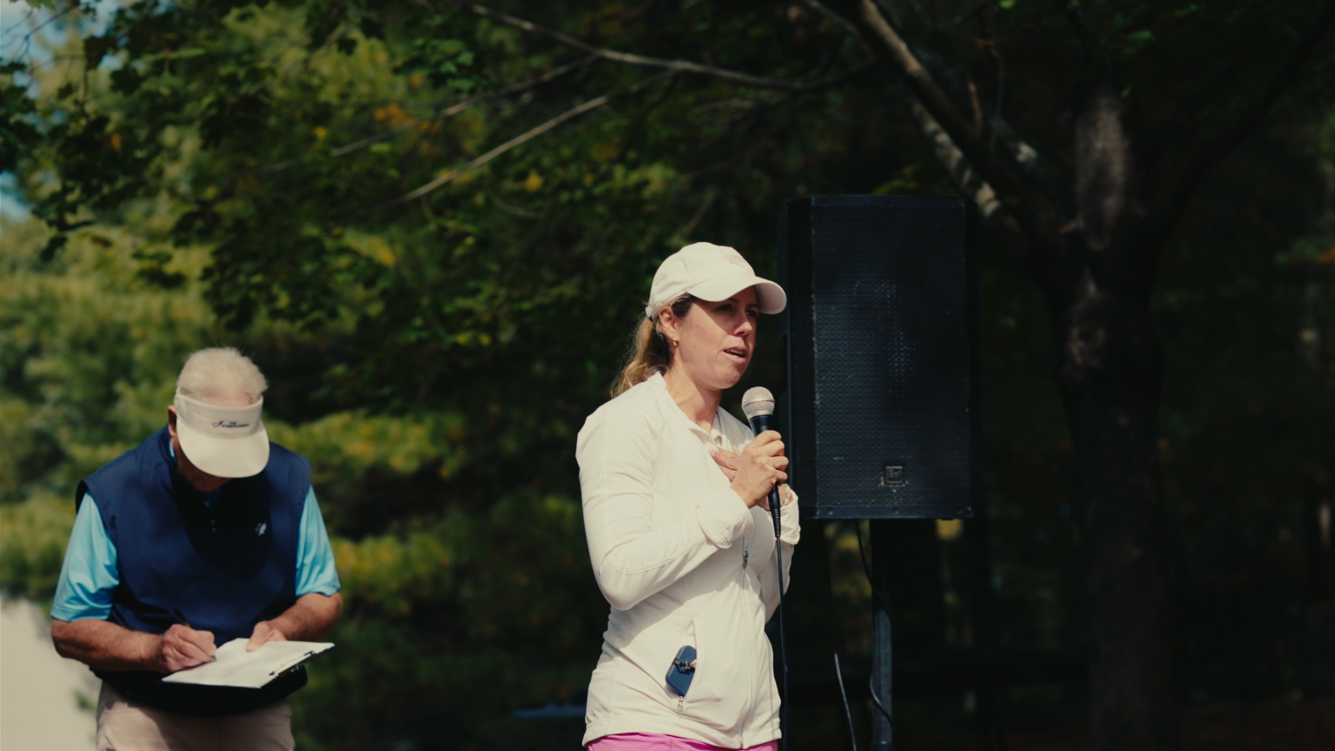 Host addressing the field with heartfelt remarks