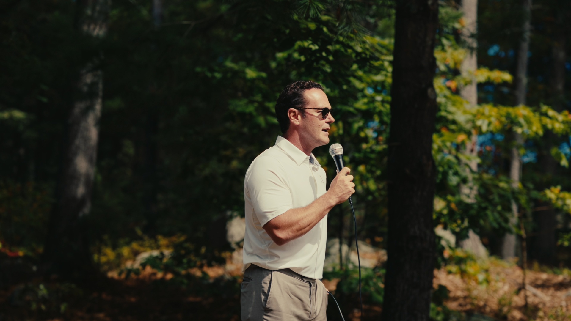 Host speaking from the tree line