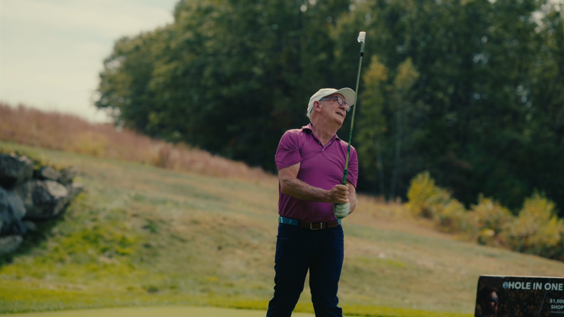 Player watching his shot fly from the Hole-in-One tee