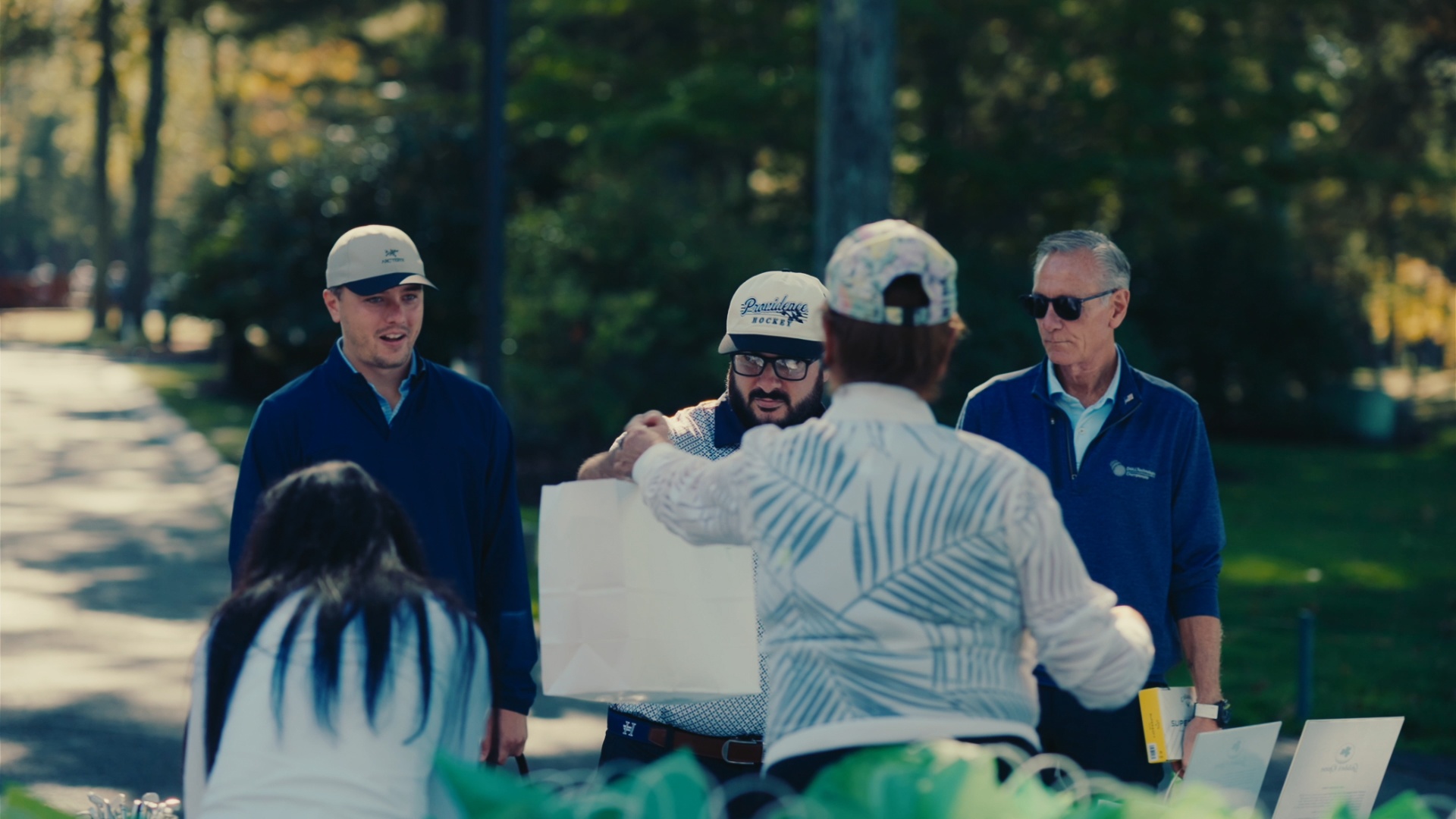 Players greeting hosts at registration