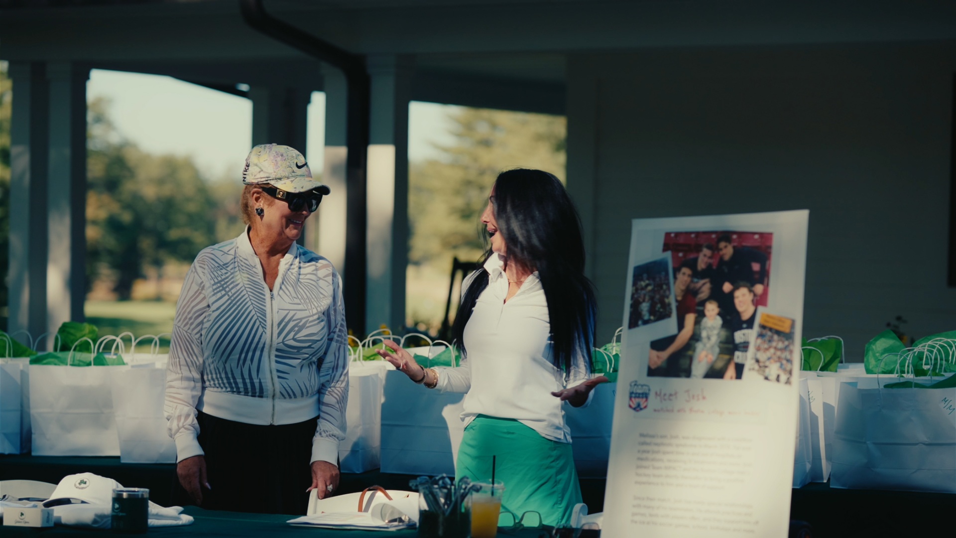 Guest learning about Team Impact at the welcome table