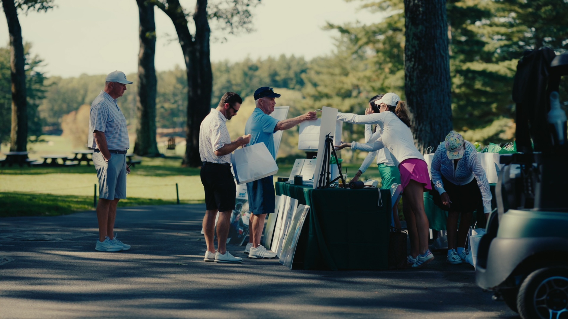 Guests collecting gift bags at the welcome table