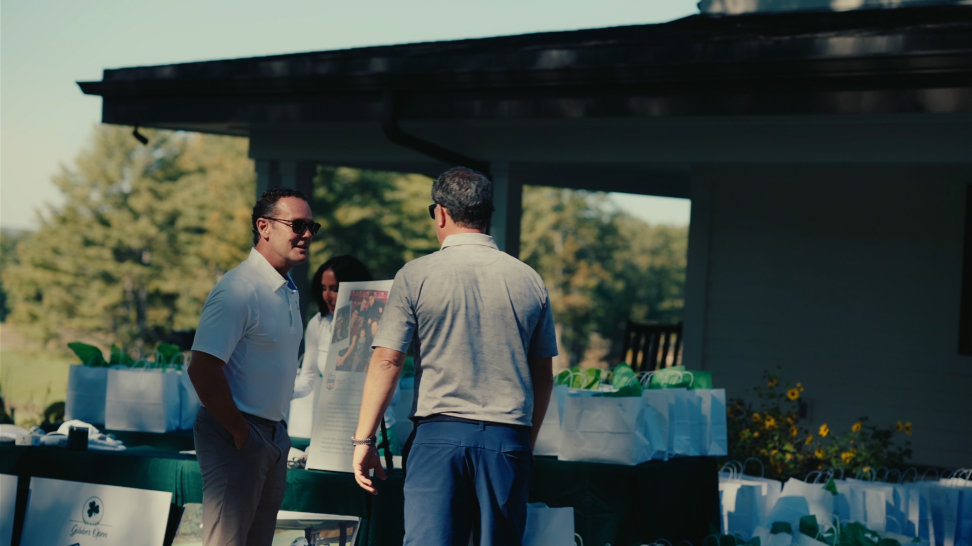 Guests catching up at the welcome table