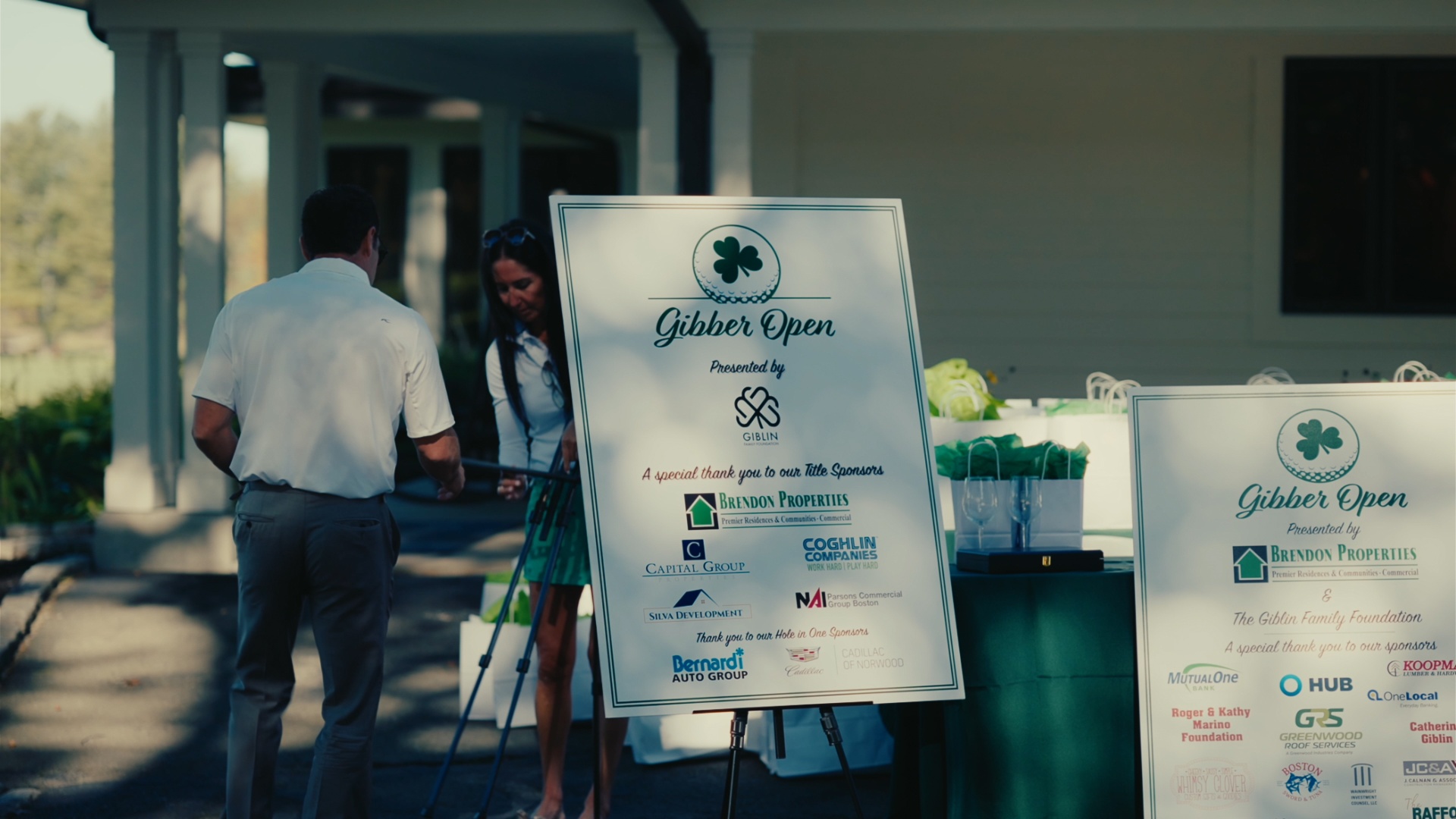 Sponsor signage at the clubhouse entrance